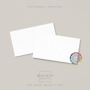 May include: Two white rectangular cards with a subtle diamond pattern, slightly overlapping on a neutral background. The cards are positioned at an angle, with the text "PHOTOSHOP • PHOTOPEA" at the top and "MOCKUP HAUS CO" and "PSD SMART OBJECT • JPG" at the bottom. A color wheel is in the corner.