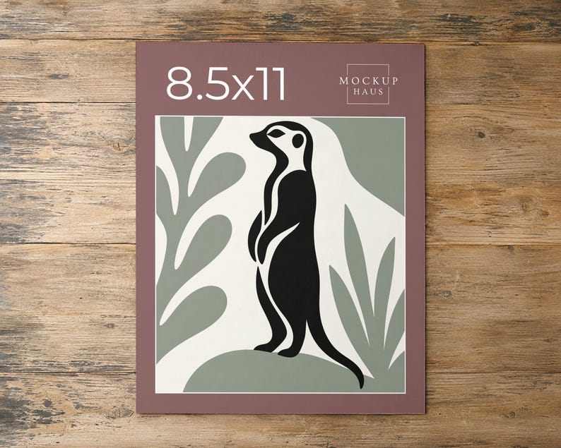 May include: A rectangular print featuring a black meerkat silhouette standing on a sage green mound against a cream background with sage green leaf shapes. The top border is mauve with the white text 8.5x11 and the logo MOCKUP HAUS.