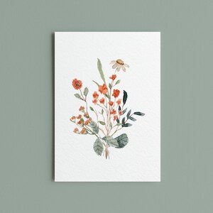 May include: Watercolor painting of a floral bouquet. The arrangement features orange and red flowers, green leaves, and a single daisy. The artwork is on a white rectangular paper against a muted green background.