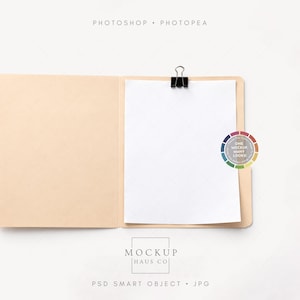 May include: Open tan file folder with a white sheet of paper clipped inside by a black binder clip. A color wheel with the text "ONE MOCKUP MANY LOOKS" is on the right. The top of the image reads "PHOTOSHOP • PHOTOPEA".