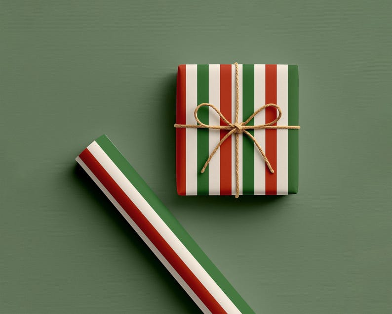 May include: A wrapped gift box and a roll of wrapping paper with red, white, and green vertical stripes. The gift is tied with twine and a bow. The background is a muted green.