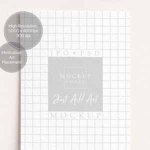 May include: A mockup image with a grid pattern background. The image includes text that reads "High Resolution 5000 x 4000px 300 dpi" and "Meticulous Art Placement". A central square features the text "MOCKUP HAUS CO" and "Just Add Art MOCKUP".