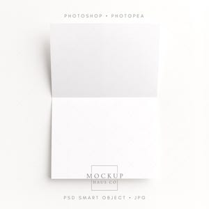 May include: A white, open greeting card mockup with a subtle diamond pattern. The card is displayed on a white surface, with the text "PHOTOSHOP • PHOTOPEA" at the top and "MOCKUP HAUS CO" and "PSD SMART OBJECT • JPG" at the bottom.