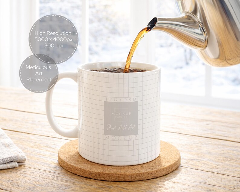 May include: A white mug with a grid pattern is filled with tea being poured from a silver teapot. The mug sits on a round cork coaster. The background includes a wooden table and a window.