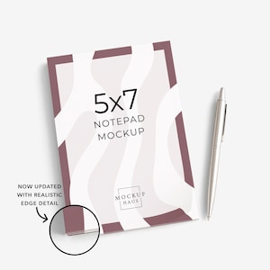May include: A 5x7 notepad mockup with a white and mauve design, accompanied by a silver pen. The notepad features the text "5x7 NOTEPAD MOCKUP" and the logo "MOCKUP HAUS". The image also includes the text "NOW UPDATED WITH REALISTIC EDGE DETAIL".