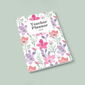 May include: A floral-patterned teacher planner for 2030. The cover features a white background with pink, purple, and orange watercolor flowers and green leaves. The title "Teacher Planner 2030" is in a white rectangular box.