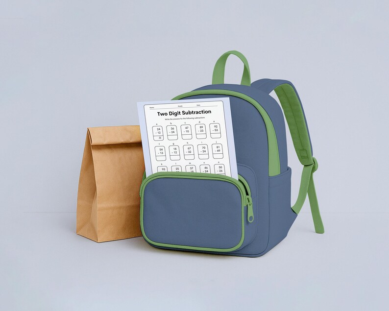 May include: A blue backpack with green accents and straps, a brown paper lunch bag, and a worksheet titled "Two Digit Subtraction" are displayed. The worksheet is visible in the front pocket of the backpack.