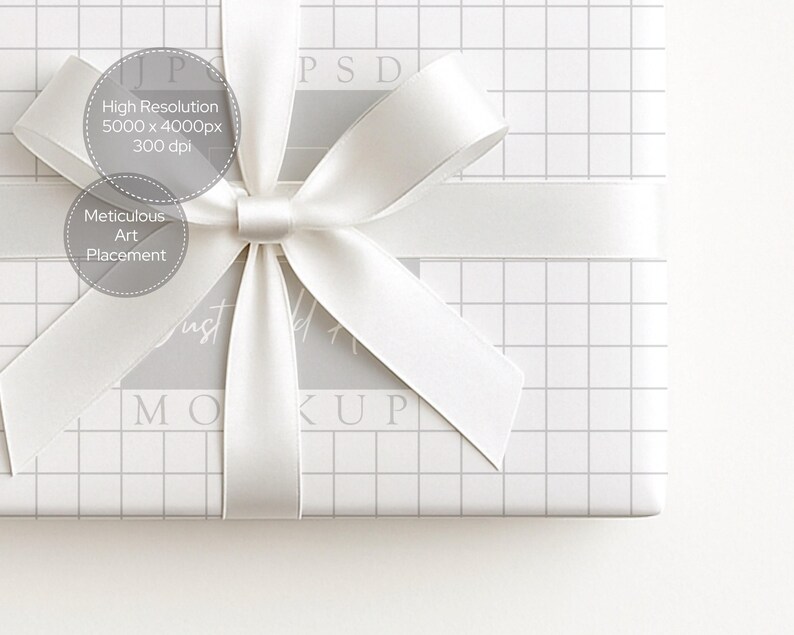 May include: A white gift box wrapped in grid-patterned paper and tied with a white satin ribbon and bow. The image includes text that reads "High Resolution 5000 x 4000px 300 dpi" and "Meticulous Art Placement". The word "MOCKUP" is also visible.