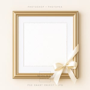 May include: A square gold picture frame with a white mat and a cream-colored ribbon tied in a bow. The frame is empty, ready for a photo or artwork. The text "PHOTOSHOP • PHOTOPAE" is at the top.