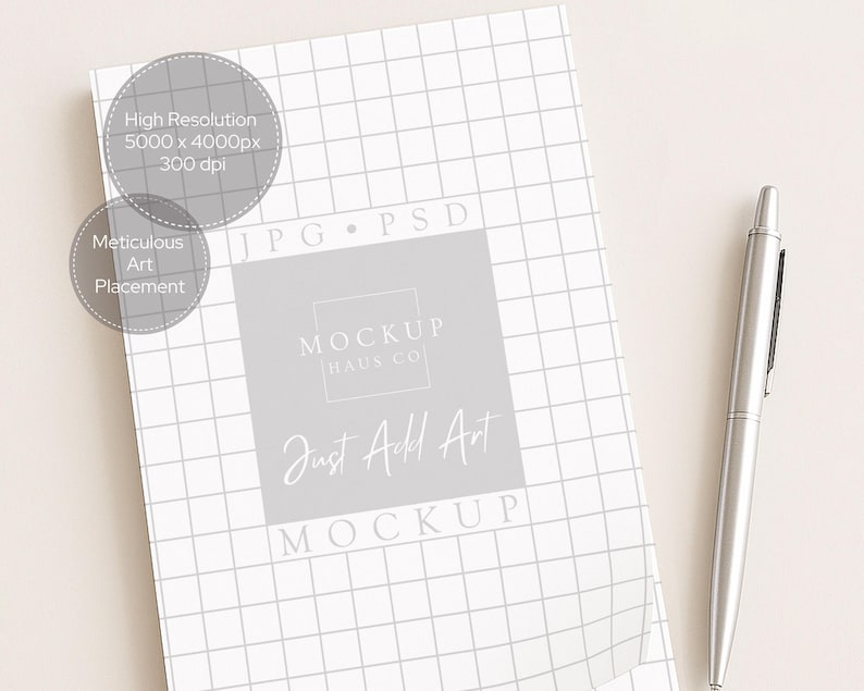 May include: A white grid-patterned mockup with the text "MOCKUP HAUS CO" and "Just Add Art". A silver pen rests on a light beige surface. The image also includes text that says "High Resolution 5000 x 4000px 300 dpi" and "Meticulous Art Placement".