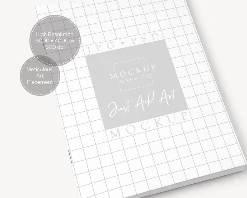 May include: A white notebook with a grid pattern, featuring the text "Just Add Art" and "Mockup" in a soft, elegant font. The image also includes text indicating high resolution and meticulous art placement.
