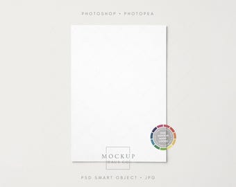 May include: A white rectangular mockup with a subtle diamond pattern. The text "PHOTOSHOP • PHOTOPEA" is at the top, and "MOCKUP HAUS CO" is at the bottom. A colour wheel graphic and text "ONE MOCKUP MANY LOOKS" are on the right. "PSD SMART OBJECT • JPG" is at the bottom.