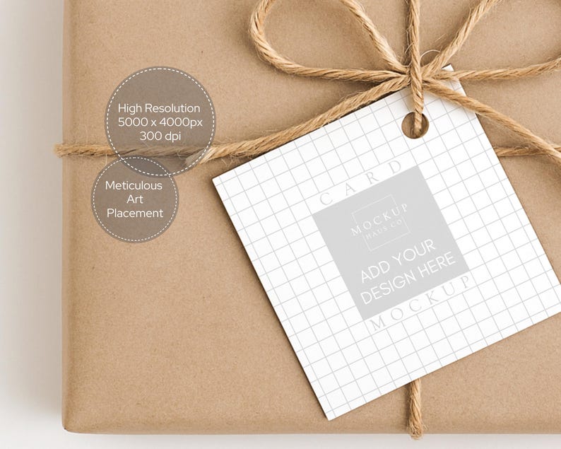 May include: A brown paper-wrapped parcel tied with twine, featuring a white tag with a grid pattern. The tag displays the words "CARD", "ADD YOUR DESIGN HERE", and "MOCKUP". The package also has text that reads "High Resolution 5000 x 4000px 300 dpi" and "Meticulous Art Placement".