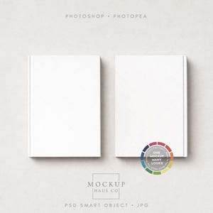May include: Two white hardcover books are displayed side-by-side on a light beige surface. The books have a clean, minimalist design, with blank covers. The image includes text at the top and bottom, and a color wheel graphic.