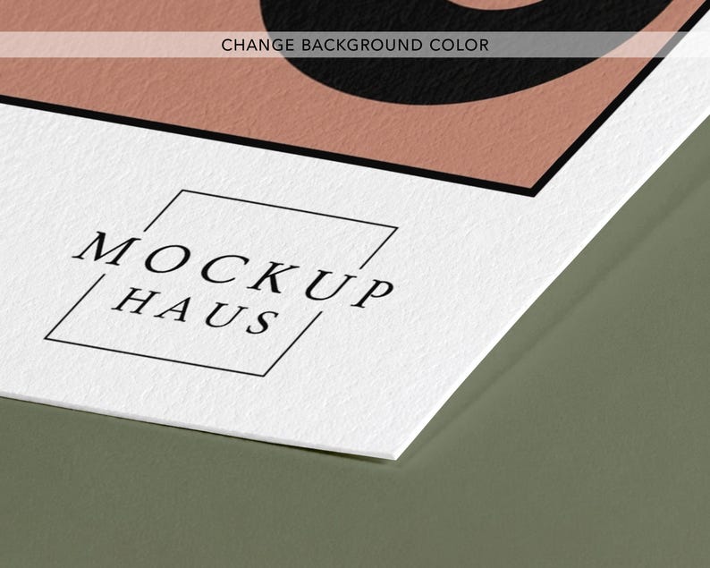 May include: A white textured paper sheet featuring a black logo with the text MOCKUP HAUS inside a thin square frame. Above the logo, a portion of a dusty pink shape with a black border is visible, along with the text CHANGE BACKGROUND COLOR.
