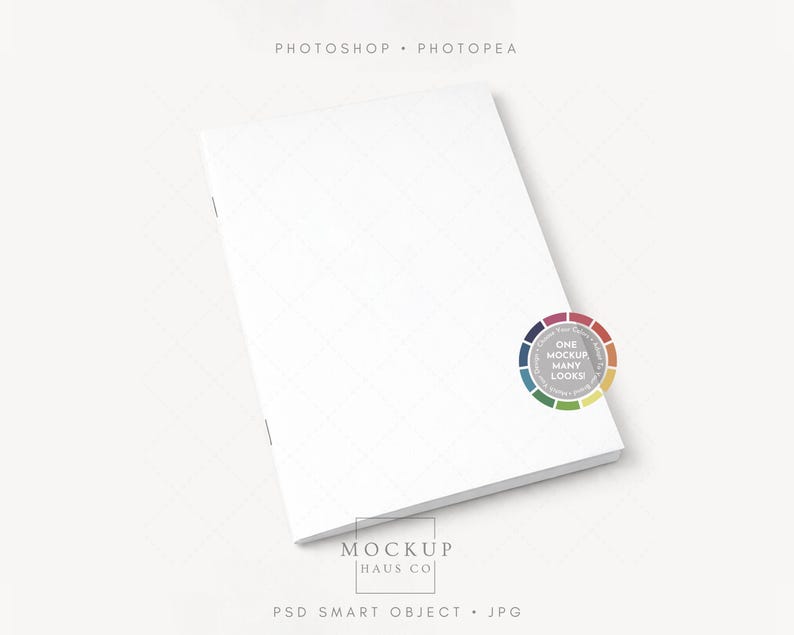 May include: A white, rectangular notebook with a subtle grid pattern on the cover. The notebook is slightly angled, showcasing its clean edges. The image includes the text "Photoshop Photpea", "One Mockup Many Looks!", and "Mockup Haus Co".