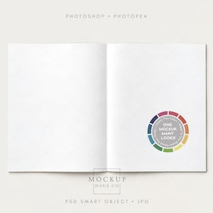 May include: An open blank notebook mockup with a white page spread. A circular color wheel graphic on the right page features the text ONE MOCKUP, MANY LOOKS! The top text reads PHOTOSHOP • PHOTOPEA and the bottom text reads MOCKUP HAUS CO PSD SMART OBJECT • JPG.