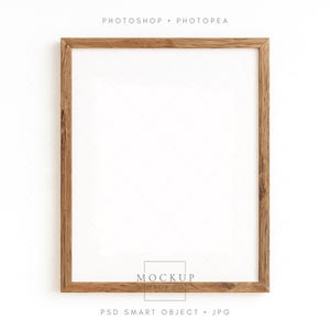 May include: A square, wooden picture frame with a light brown finish. The frame has a white interior and is set against a white background. The text "PHOTOSHOP • PHOTOPEA" is at the top, and "MOCKUP HAUS CO" and "PSD SMART OBJECT • JPG" are at the bottom.