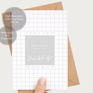 May include: A white card with a grid pattern and the text "Just Add Art MOCKUP" is held over a brown envelope. The card also has the text "High Resolution 5000 x 4000px 300 dpi" and "Meticulous Art Placement".