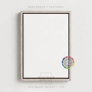 Könnte beinhalten: Eine rechteckige Leinwand in einem Holzrahmen, ideal zum Präsentieren von Kunstwerken oder Fotos. Der Rahmen hat eine hellgraue Oberfläche. Das Bild enthält den Text "PHOTOSHOP • PHOTOPAE" und "MOCKUP HAUS CO".
