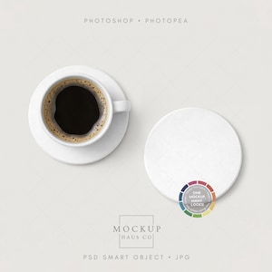 May include: Overhead shot of a white coffee cup and saucer filled with dark coffee, next to a white coaster. The image includes the text "PHOTOSHOP • PHOTOPEA" and "MOCKUP HAUS CO". A colorful logo is also visible.