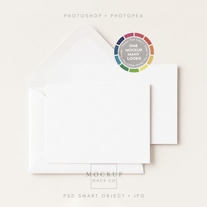 May include: A white stationery mockup featuring a folded envelope, a card, and a smaller card. A color wheel graphic with the text "ONE MOCKUP, MANY LOOKS!" is in the upper right corner. The text "MOCKUP HAUS CO" is at the bottom.