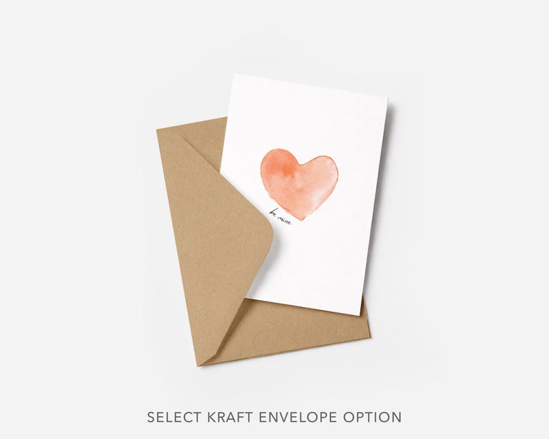 Puede incluir: Una tarjeta blanca con un coraz&oacute;n naranja estilo acuarela y las palabras "be mine" en escritura negra. La tarjeta est&aacute; dentro de un sobre de papel kraft marr&oacute;n. El texto "SELECT KRAFT ENVELOPE OPTION" est&aacute; en la parte inferior.
