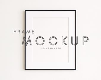 May include: A black framed picture frame mockup with a white mat. The text "FRAME MOCKUP" is above the frame, and "JPG • PNG • PSD" is below. The frame is rectangular and is set against a white background.