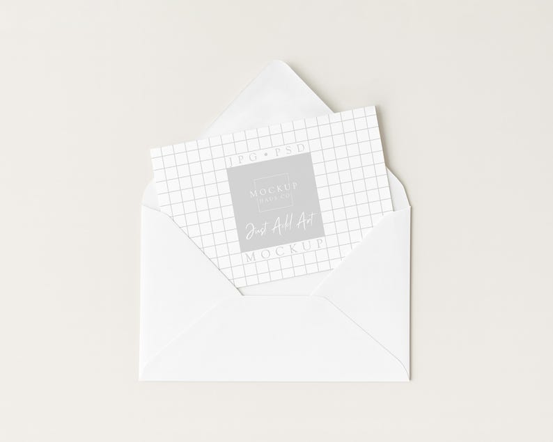 May include: A white envelope with a card inside. The card has a grid pattern and the text "JPG PSD MOCKUP MAKER Just All Art MOCKUP" in a gray square. The envelope is open, revealing the card.