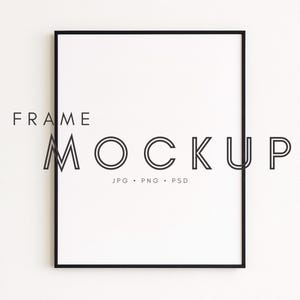 May include: A black framed rectangular mockup with a white interior. The text "FRAME MOCKUP" is at the top, with "JPG • PNG • PSD" below the word "MOCKUP". The frame is centered on a white background.