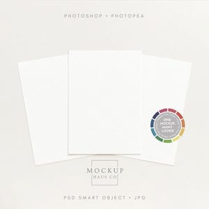 May include: Three white blank cards arranged on a light background. The cards are positioned to create a visual display. A colourful circular graphic with the text "ONE MOCKUP MANY LOOKS!" is on the right. The text "MOCKUP HAUS CO" is at the bottom.