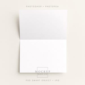 May include: A folded white card with a delicate diamond pattern, set against a neutral background. The card is open, revealing a blank interior, ideal for custom messages. The text "PHOTOSHOP • PHOTOPEA" is at the top, and "MOCKUP HAUS CO" and "PSD SMART OBJECT • JPG" are at the bottom.