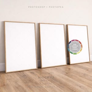 May include: Three rectangular framed art prints with a white interior, leaning against a white wall. The frames are a light brown color. The prints are on a wooden floor. The text "ONE MOCKUP MANY LOOKS" is visible.