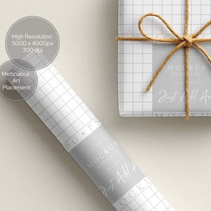 May include: A roll of white grid paper with the text "MOCKUP HAUS CO" and "Just Add Art" in a grey banner. A wrapped gift with a twine bow and the same text is also visible. The image also includes text that says "High Resolution 5000 x 4000px 300 dpi" and "Meticulous Art Placement."