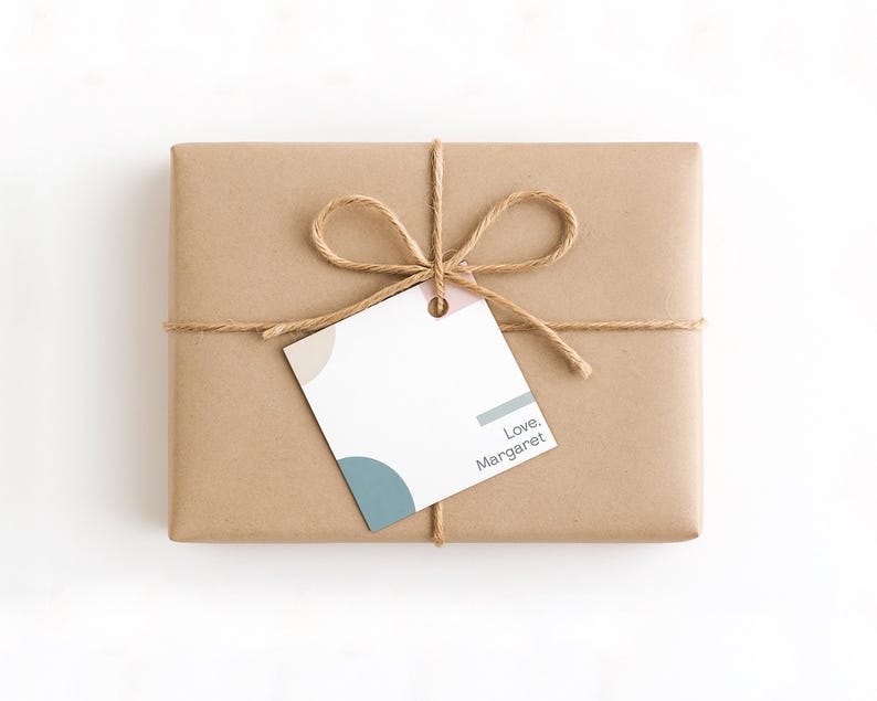 May include: A rectangular gift wrapped in brown paper, tied with twine, and a tag. The tag has a design with beige, blue, and pink accents, and the text "Love, Margaret".