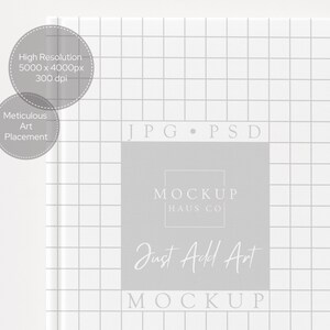 May include: A white book cover with a grid pattern and the text "JPG PSD" at the top. A gray rectangle in the center features the text "MOCKUP HAUS CO" and "Just Add Art MOCKUP". Two gray circles with text are in the upper left.