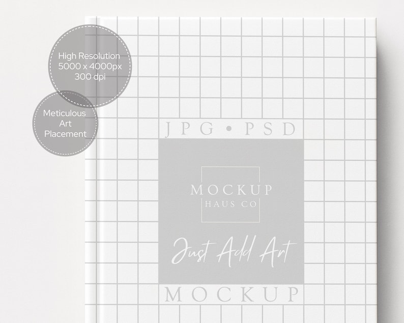 May include: A white book cover with a grid pattern and the text "JPG PSD" at the top. A gray rectangle in the center features the text "MOCKUP HAUS CO" and "Just Add Art MOCKUP". Two gray circles with text are in the upper left.