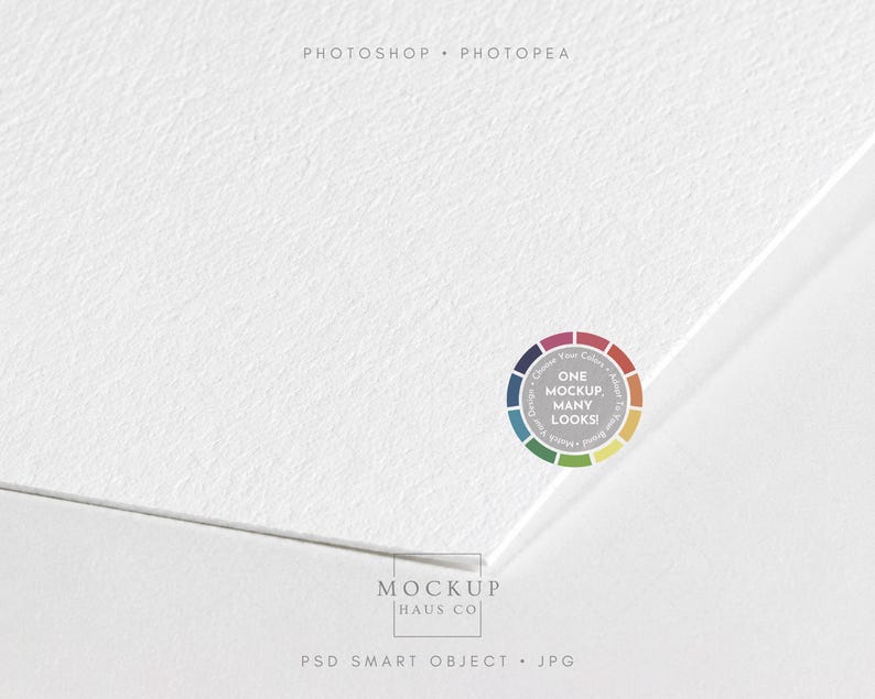 May include: A white textured paper mockup with a corner folded over. The image features the text PHOTOSHOP &bull; PHOTOPEA at the top, a circular color wheel graphic with the text ONE MOCKUP. MANY LOOKS!, and MOCKUP HAUS CO PSD SMART OBJECT &bull; JPG at the bottom.