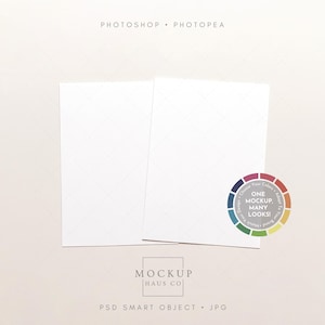 May include: Two white rectangular cards with a subtle diamond pattern, set against a neutral background. A colorful circular graphic with the text "ONE MOCKUP, MANY LOOKS!" is on the right. The text "PHOTOSHOP • PHOTOPEA" is at the top.