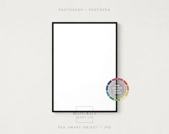 May include: A black framed rectangular mockup with a white interior, ideal for displaying art or photos. The words "PHOTOSHOP • PHOTOPEA" are at the top. A color wheel graphic with the text "ONE MOCKUP MANY LOOKS!" is on the right. The text "MOCKUP HAUS CO" is at the bottom.