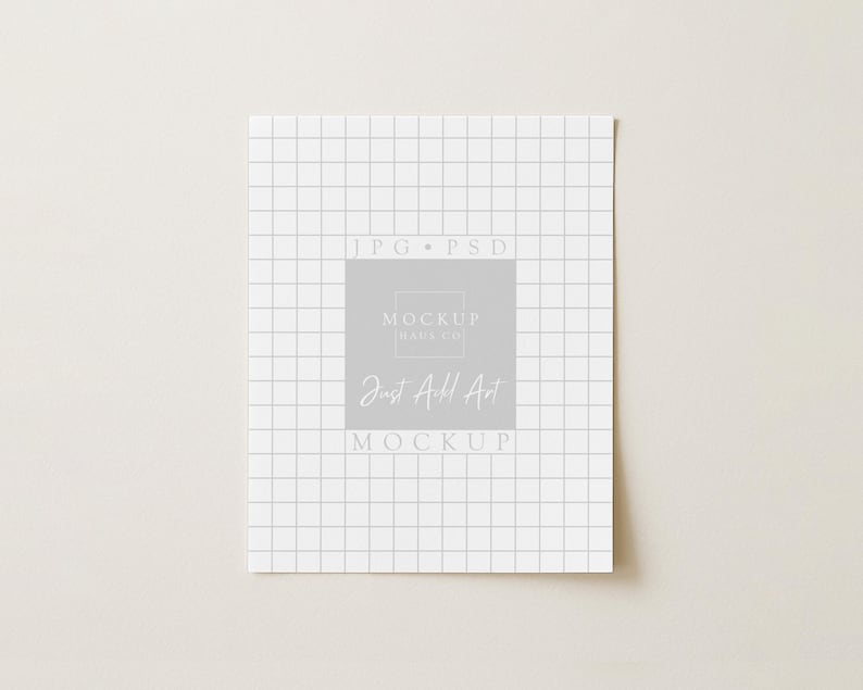 May include: A white square paper with a grid pattern and the text "JPG * PSD" at the top. A gray square in the center contains the text "MOCKUP RAUS CO." and "Just Add Art MOCKUP" in a handwritten font.
