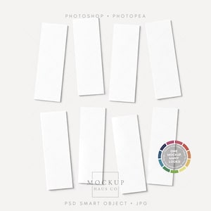 May include: A mockup image featuring eight white rectangular cards arranged on a light gray background. The cards are positioned at various angles, creating a visually appealing layout. The image includes text: "PHOTOSHOP • PHOTOPEA" and "MOCKUP HAUS CO".