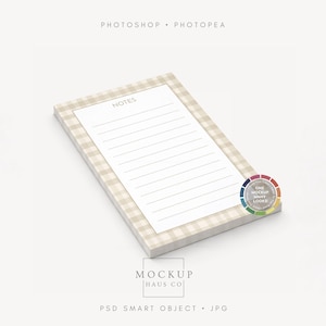 May include: A notepad with a white lined paper and the word "NOTES" at the top. The notepad is set on a beige and white checkered pattern. The image also includes a color wheel and the text "MOCKUP HAUS CO".