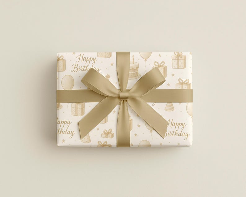 May include: A wrapped gift box with a gold ribbon and bow. The wrapping paper is white with a repeating pattern of birthday-themed illustrations in a light brown color, including gifts, balloons, and cakes. The words "Happy Birthday" are also printed on the paper.