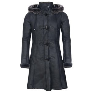 May include: A black long coat with a hood trimmed with faux fur. The coat has toggle closures and a tailored fit. The sleeves have fur cuffs. This winter coat is designed for warmth and style.