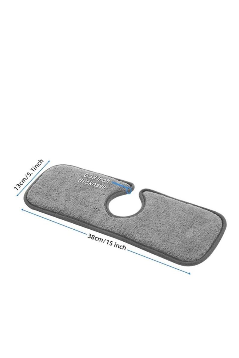 May include: A gray microfiber sink mat, 15 inches long, 5.1 inches wide, and 0.39 inches thick. The mat has a curved cutout for the faucet and is designed to protect the countertop from water damage.