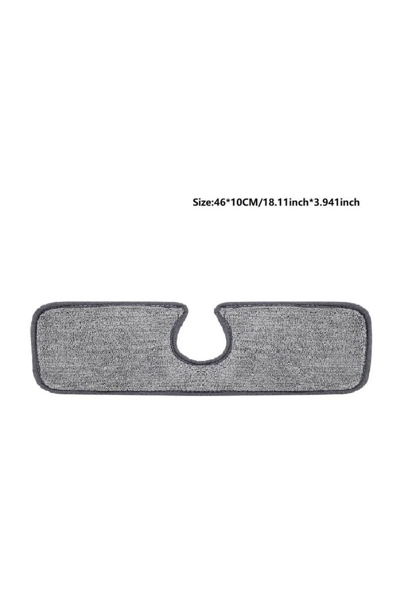 May include: A rectangular gray cleaning pad with a curved cutout. The pad is 18.11 inches long and 3.941 inches wide. The pad has a dark gray border.
