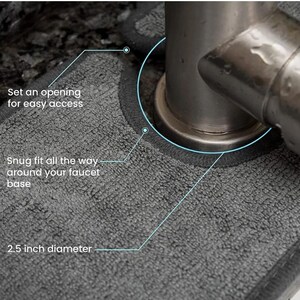 May include: A gray microfiber faucet base mat with a dark gray border. The mat has a 2.5-inch diameter and is designed to fit snugly around the faucet base. Text on the mat reads: "Set an opening for easy access" and "Snug fit all the way around your faucet base."