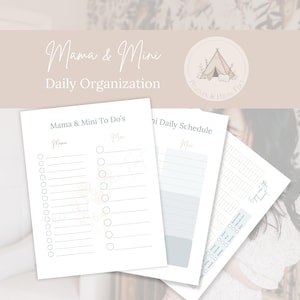 May include: A stack of white paper daily organization sheets with the text "Mama & Mini" and "Daily Organization". The sheets include "Mama & Mini To Do's" and "Daily Schedule" templates. A logo with a tent and floral elements is in the upper right corner.