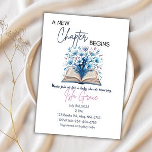 May include: A baby shower invitation with the text "A New Chapter Begins." The invitation features a floral illustration above an open book. The invitation includes the name Isla Grace, date, time, and RSVP information.